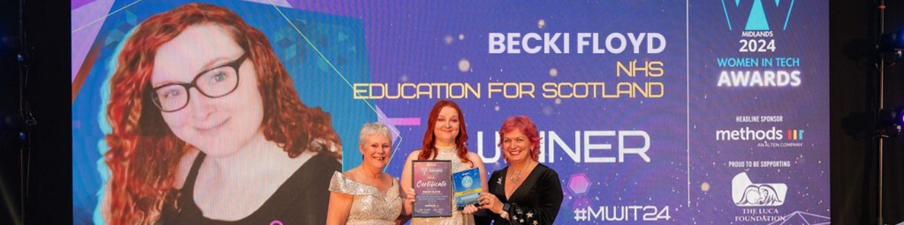 Becki Floyd on stage winning at the 2024 Midlands Women in Tech Awards